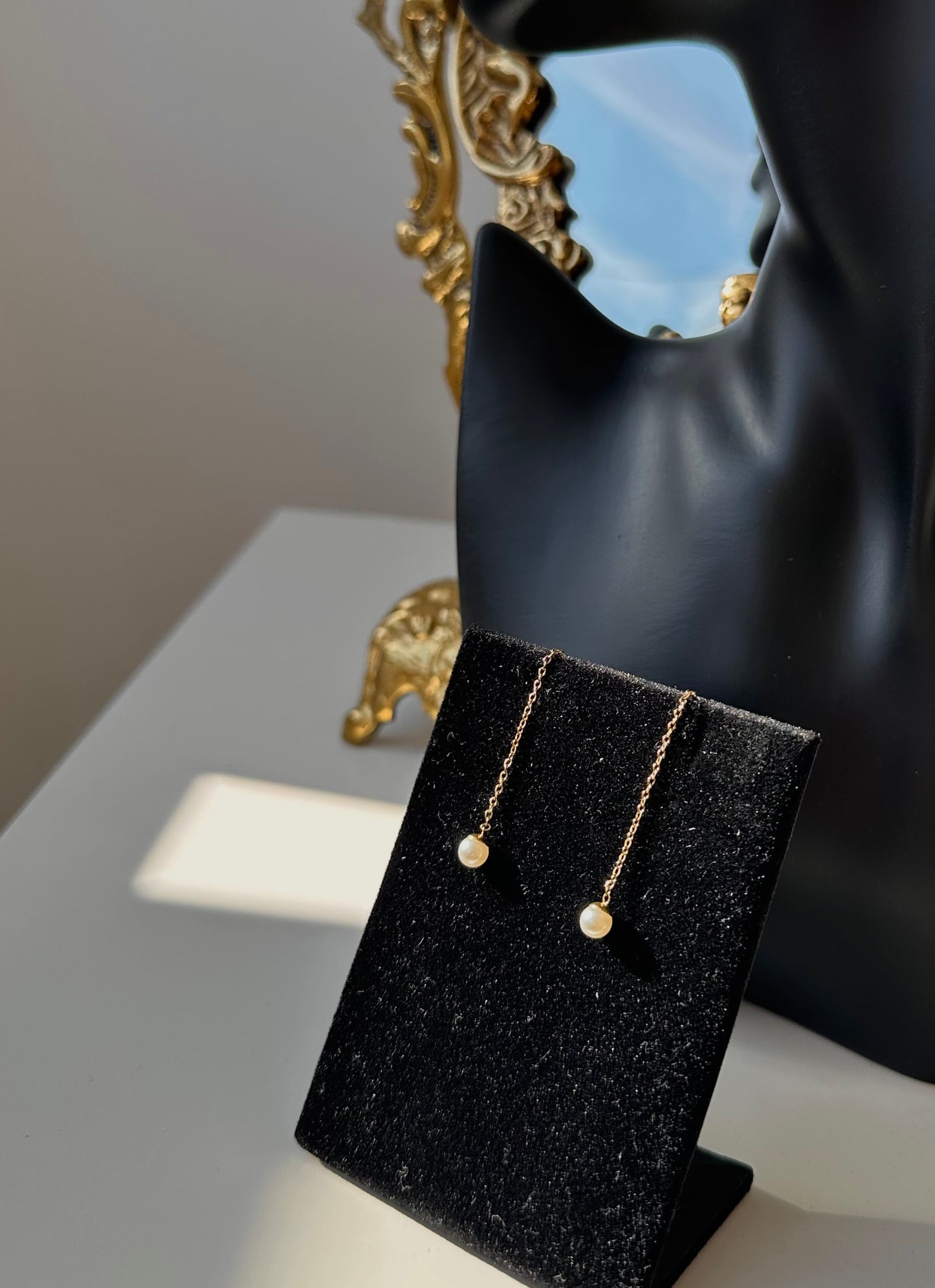 Boucle d’oreille pendantes perle